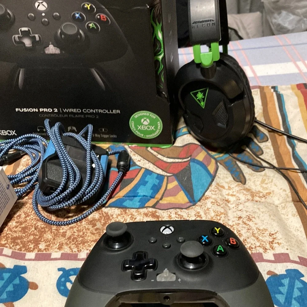 Xbox one s with a headset and 15 games and a zen